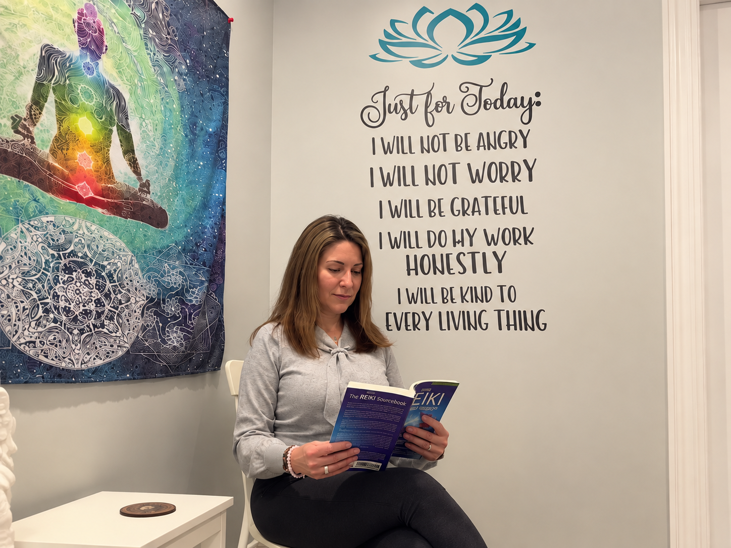 Marcella reading the Reiki Sourcebook