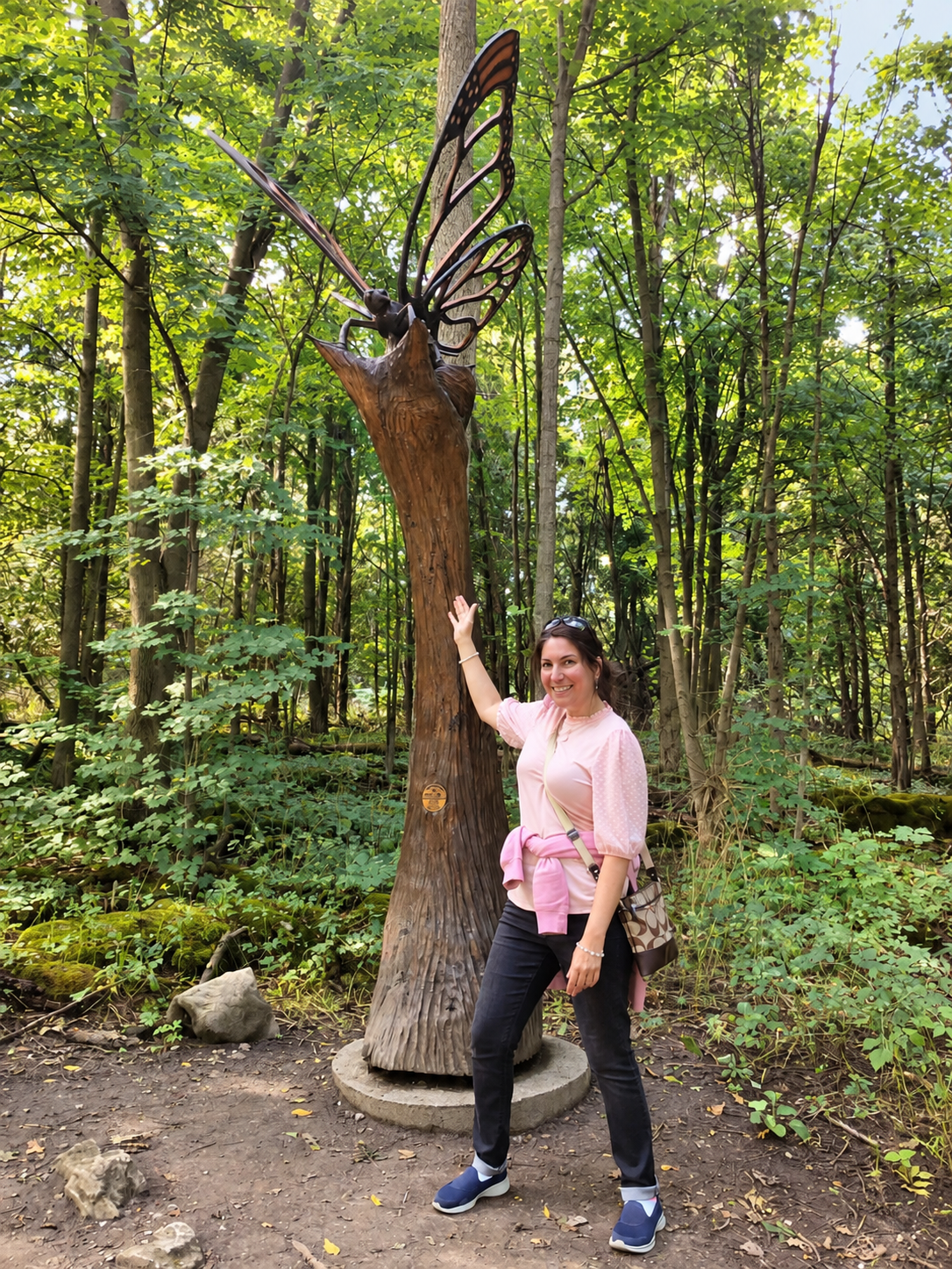 Marcella at the butterfly sculpture